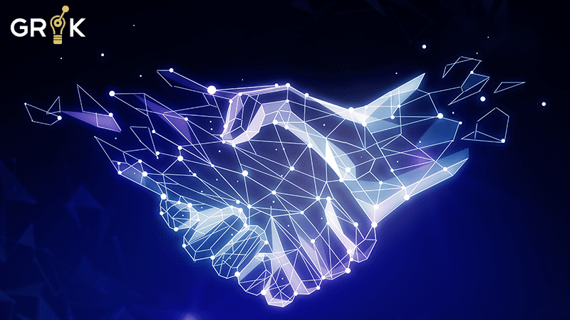 A glowing digital handshake against a blue backdrop, representing the integration in domain-agnostic AIOps, accompanied by the Grok logo