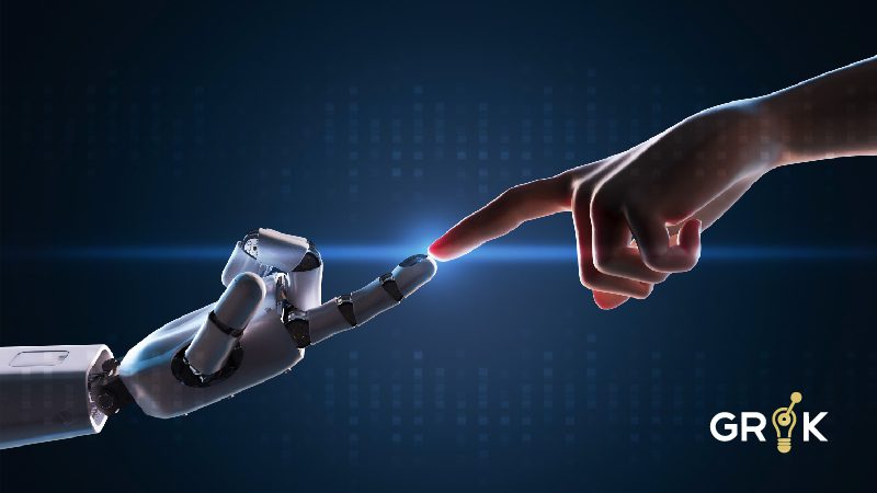 Human and robot hand touching, illustrating the AIOps Impact in technology and artificial intelligence.